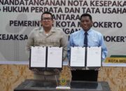 Pj Wali Kota Mojokerto, Moh Ali Kuncoro, Kajari Kota Mojokerto, Bobby Ruswin, MoU Pendampingan Hukum [foto: Dwi Yuliyanto]